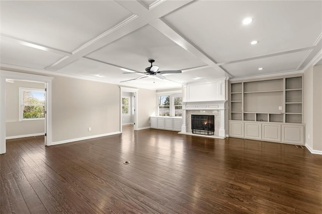 unfurnished living room featuring a premium fireplace, baseboards, coffered ceiling, and dark wood finished floors