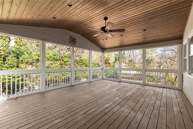 unfurnished sunroom with lofted ceiling, wood ceiling, and ceiling fan