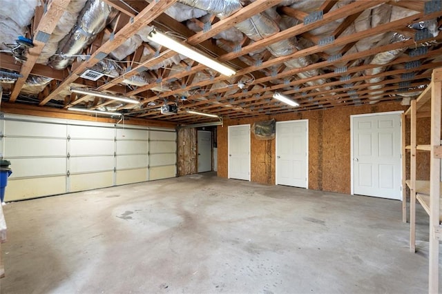 garage featuring visible vents and a garage door opener