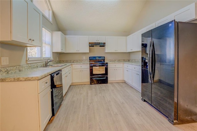 kitchen with black appliances, white cabinetry, and sink