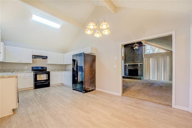 kitchen featuring black appliances, ceiling fan with notable chandelier, a fireplace, decorative light fixtures, and white cabinetry