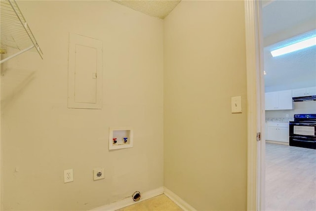 clothes washing area featuring hookup for an electric dryer, electric panel, and washer hookup