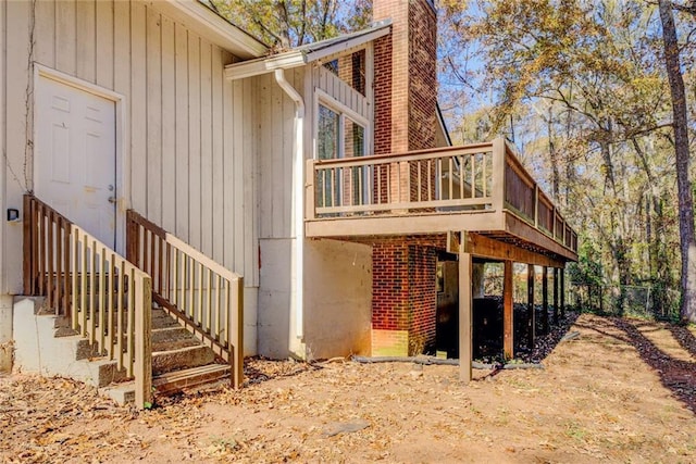 view of side of property with a deck