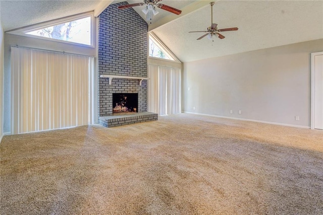 unfurnished living room featuring carpet flooring, ceiling fan, lofted ceiling with beams, a textured ceiling, and a fireplace