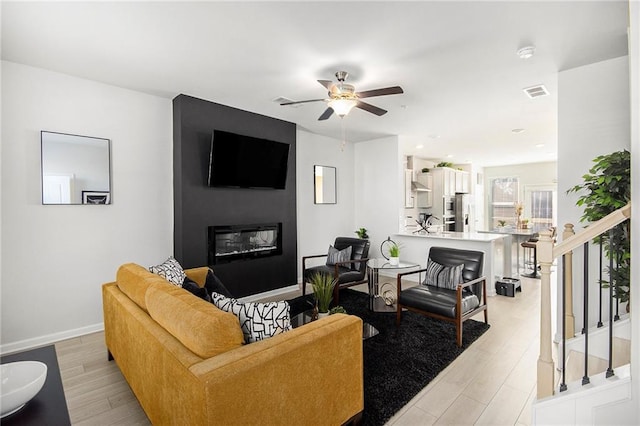 110 Cobalt Dr, Fayetteville, GA 30214 - living room with ceiling fan and light wood-type flooring