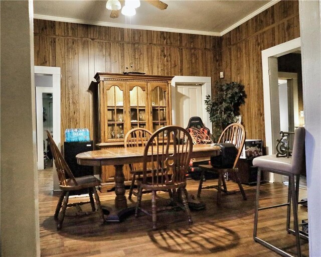 405 Pennington Ave SW, Rome, GA 30161 - dining area featuring crown molding, wood walls, ceiling fan, and wood finished floors