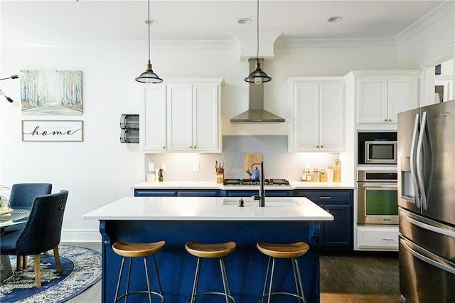 538 Micayne Cir Unit 3, Smyrna, GA 30082 - kitchen with appliances with stainless steel finishes, light countertops, a breakfast bar area, white cabinets, and dark wood-style flooring