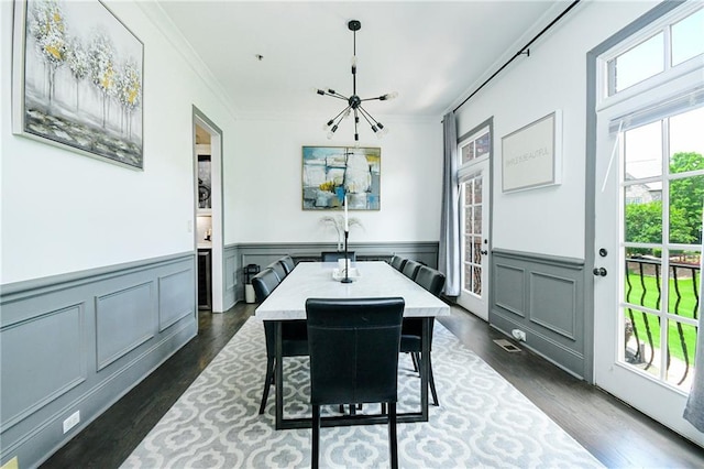 538 Micayne Cir Unit 3, Smyrna, GA 30082 - dining room with a chandelier, crown molding, dark wood-style floors, and a wainscoted wall