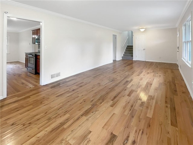 unfurnished living room featuring light hardwood / wood-style flooring and ornamental molding