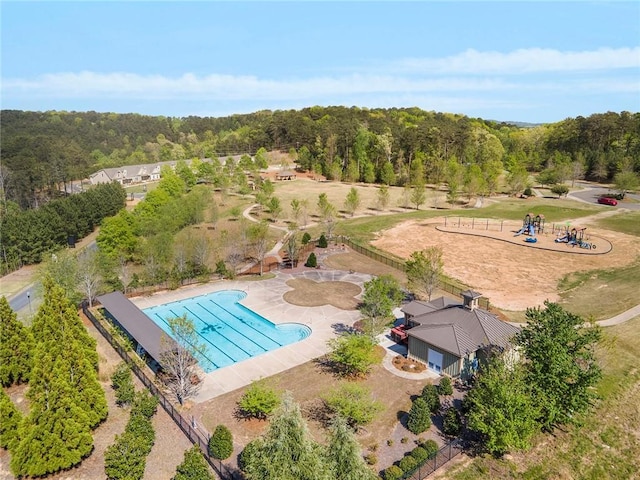 birds eye view of property with a wooded view