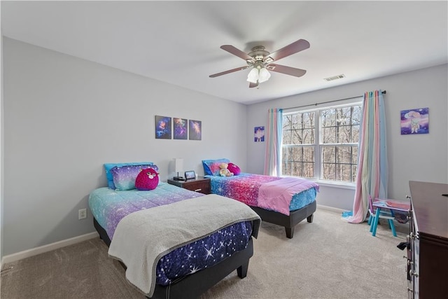 carpeted bedroom featuring a ceiling fan, baseboards, and visible vents