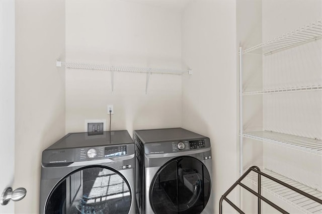 washroom featuring independent washer and dryer