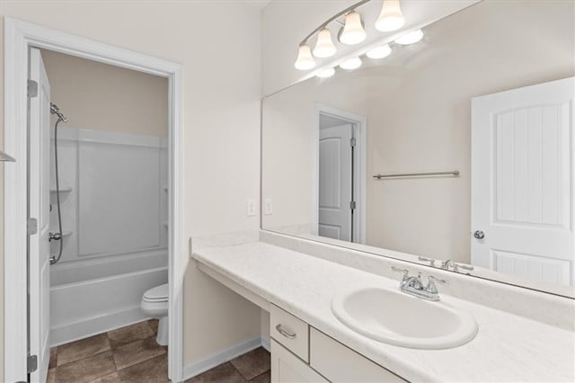 full bathroom featuring vanity, washtub / shower combination, and toilet