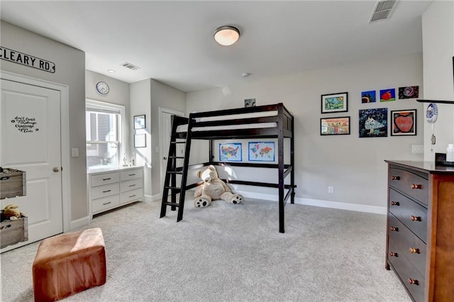 bedroom with light colored carpet