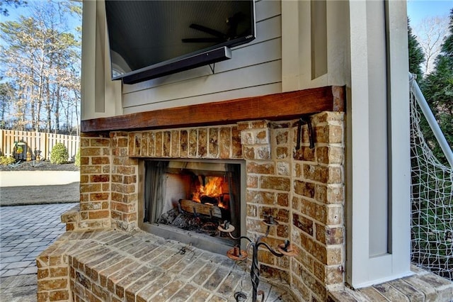 details with an outdoor brick fireplace