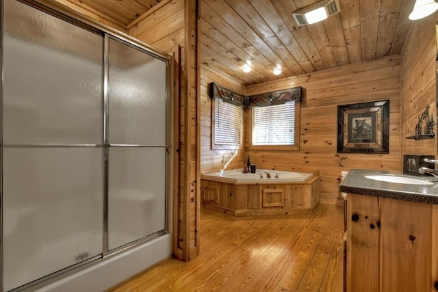 bathroom with separate shower and tub, wood walls, wooden ceiling, and hardwood / wood-style flooring