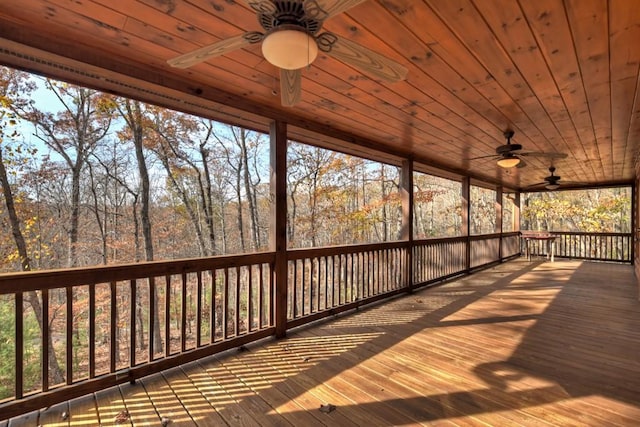 wooden terrace featuring ceiling fan