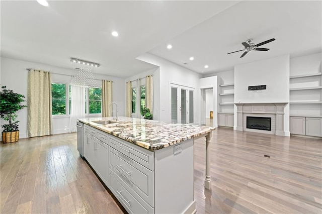 304 Old Cove Rd N, Jasper, GA 30143 - kitchen with stainless steel dishwasher, light wood-style floors, recessed lighting, a kitchen island with sink, and a ceiling fan