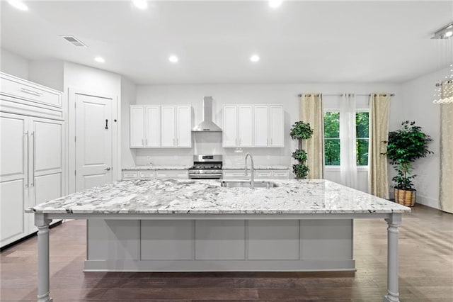 304 Old Cove Rd N, Jasper, GA 30143 - kitchen with wall chimney exhaust hood, gas stove, a large island, white cabinets, and recessed lighting