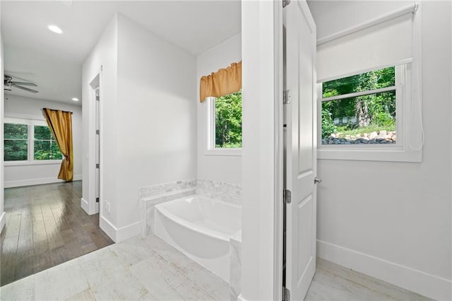 304 Old Cove Rd N, Jasper, GA 30143 - bathroom featuring a bath, healthy amount of natural light, recessed lighting, wood finished floors, and a ceiling fan