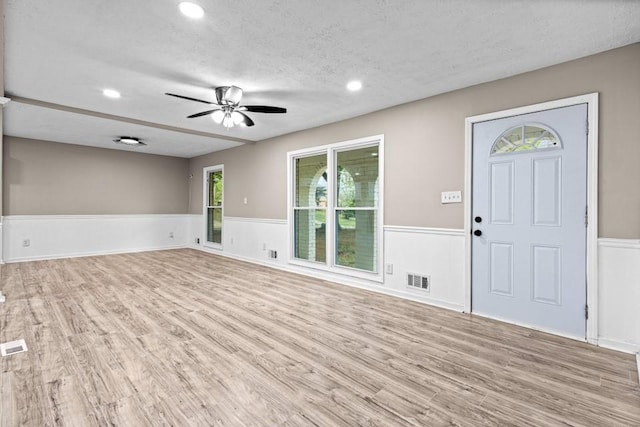 2617 Peggy Sue Ln, Morrow, GA 30260 - unfurnished living room featuring a wainscoted wall, a ceiling fan, wood finished floors, a textured ceiling, and recessed lighting