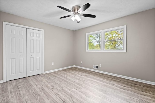 2617 Peggy Sue Ln, Morrow, GA 30260 - unfurnished bedroom with light wood-type flooring, baseboards, and a closet