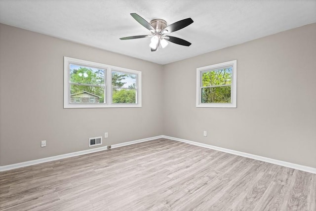 2617 Peggy Sue Ln, Morrow, GA 30260 - empty room featuring light wood finished floors, plenty of natural light, and baseboards
