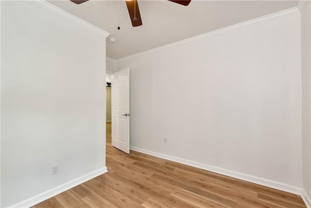 empty room featuring crown molding, ceiling fan, and light hardwood / wood-style flooring