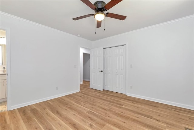 unfurnished bedroom with ornamental molding, ensuite bathroom, ceiling fan, and light hardwood / wood-style flooring