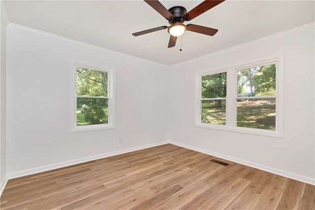 unfurnished room featuring ceiling fan, ornamental molding, and light hardwood / wood-style floors