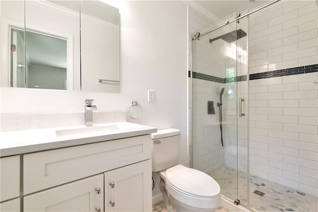 bathroom with vanity, an enclosed shower, and toilet