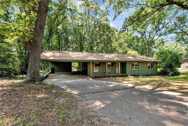 single story home featuring a carport