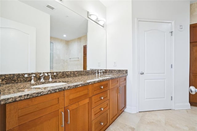 2828 Peachtree Rd NW Unit 2002, Atlanta, GA 30305 - bathroom with double vanity and tiled shower