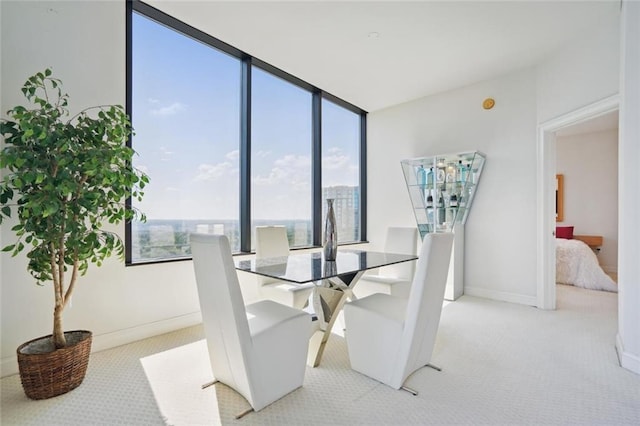 2828 Peachtree Rd NW Unit 2002, Atlanta, GA 30305 - carpeted dining space with plenty of natural light and floor to ceiling windows