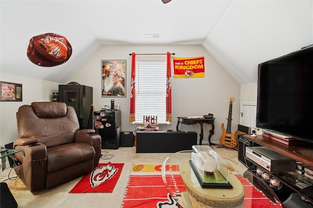 interior space featuring light colored carpet and vaulted ceiling