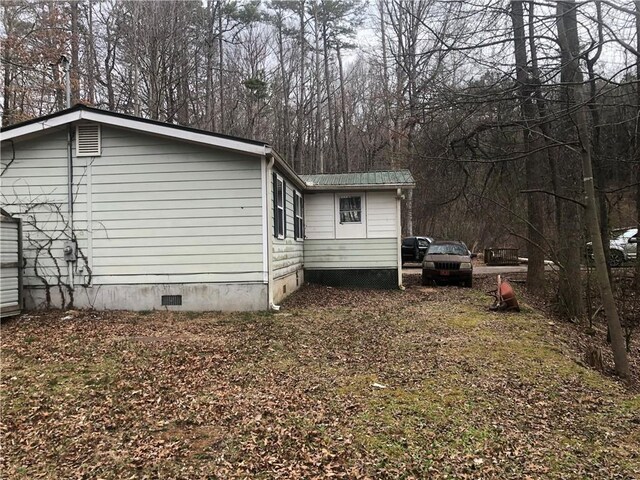view of home's exterior with crawl space