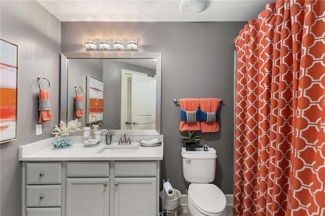 bathroom with vanity, toilet, and a shower with shower curtain