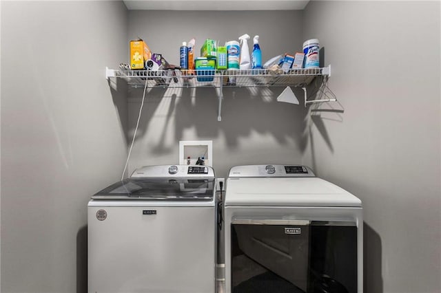 laundry area with washing machine and dryer