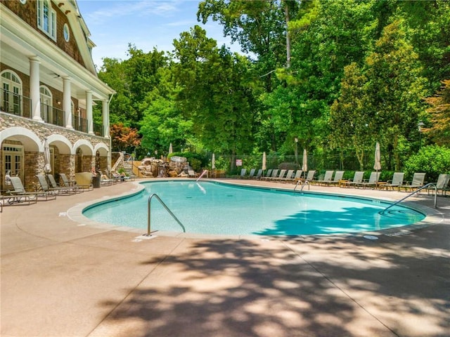 view of swimming pool featuring a patio area