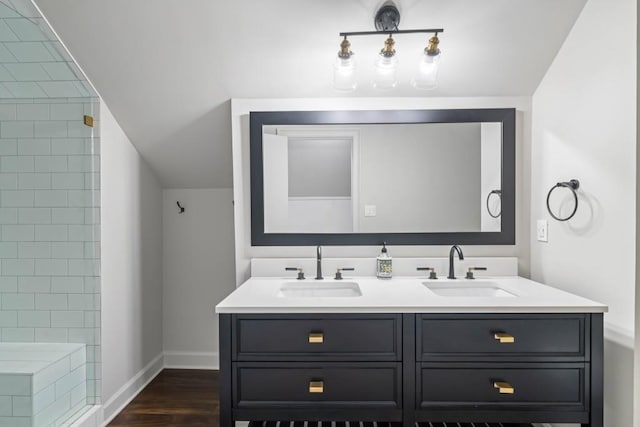 1430 N Harris Rdg, Atlanta, GA 30327 - bathroom featuring double vanity, baseboards, wood finished floors, and a tile shower