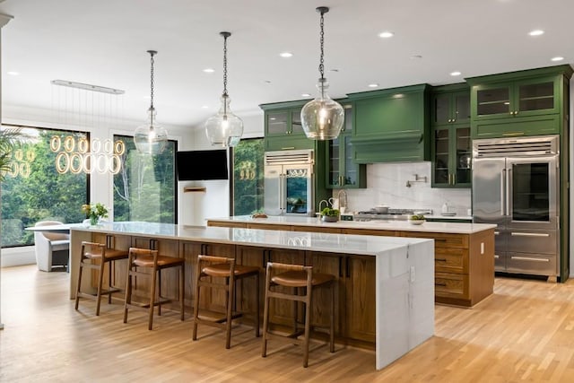 1430 N Harris Rdg, Atlanta, GA 30327 - kitchen with a large island, high end fridge, green cabinetry, stainless steel built in fridge, and recessed lighting