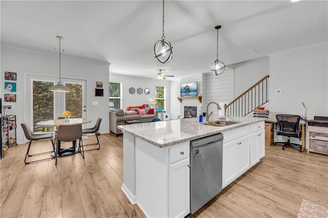 5615 Parkview Ln, Flowery Branch, GA 30542 - kitchen with dishwasher, a glass covered fireplace, light wood-type flooring, white cabinets, and ceiling fan