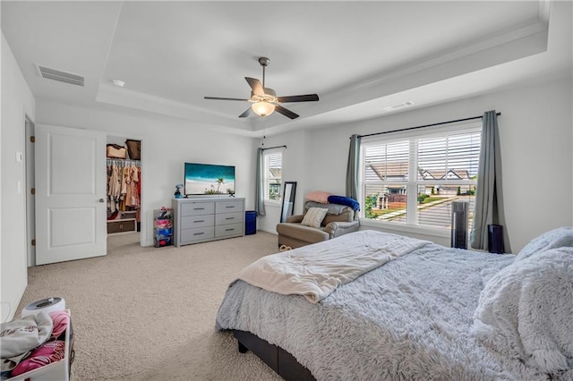 5615 Parkview Ln, Flowery Branch, GA 30542 - carpeted bedroom with a tray ceiling and ceiling fan
