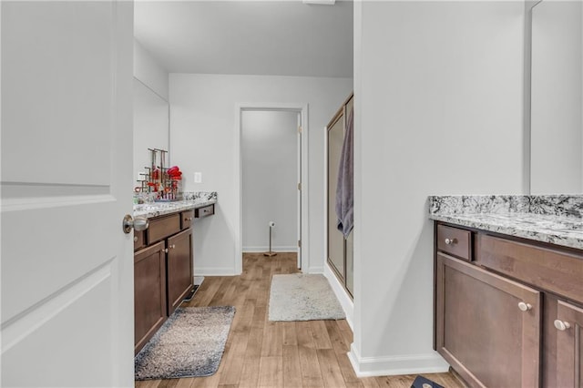 5615 Parkview Ln, Flowery Branch, GA 30542 - full bathroom with vanity, wood finished floors, and a stall shower