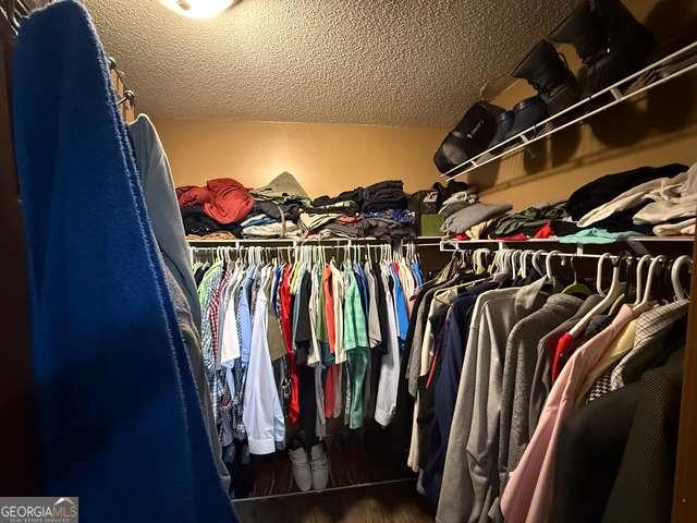 3269 N Winds Trl N, Douglasville, GA 30135 - spacious closet featuring wood finished floors