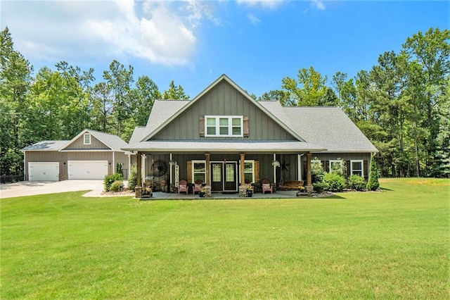 craftsman-style home with a porch, a garage, and a front lawn