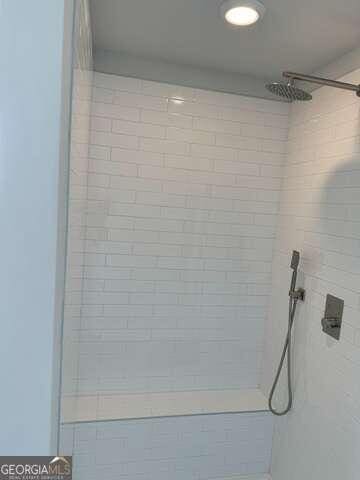 room details with a tile shower