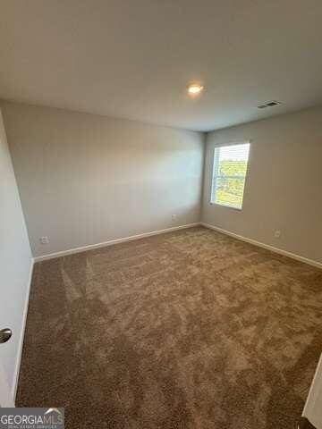 view of carpeted spare room