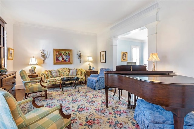 carpeted living area with decorative columns and ornamental molding