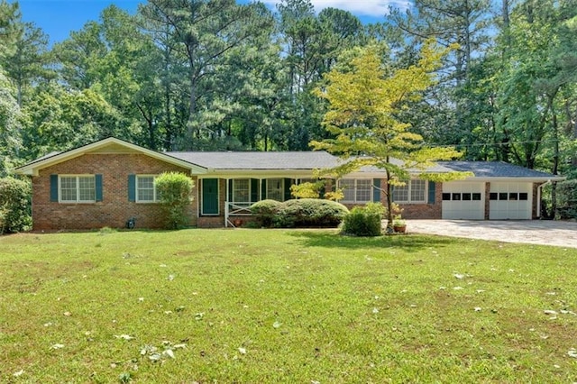 single story home with a garage and a front lawn